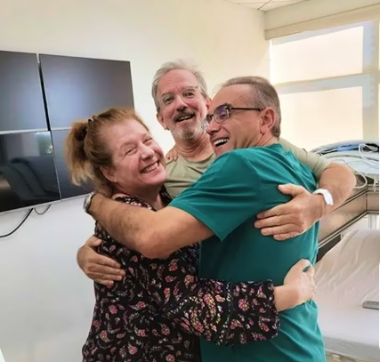 Patients embracing their physician after treatment